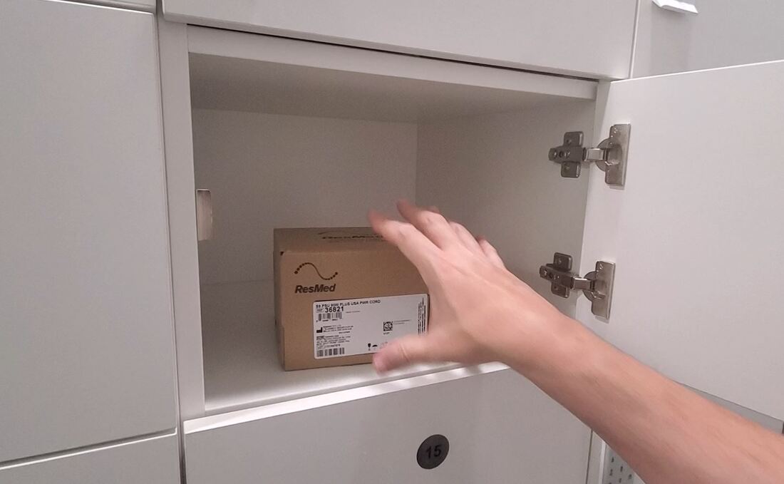 Picture removing an item from a locker box